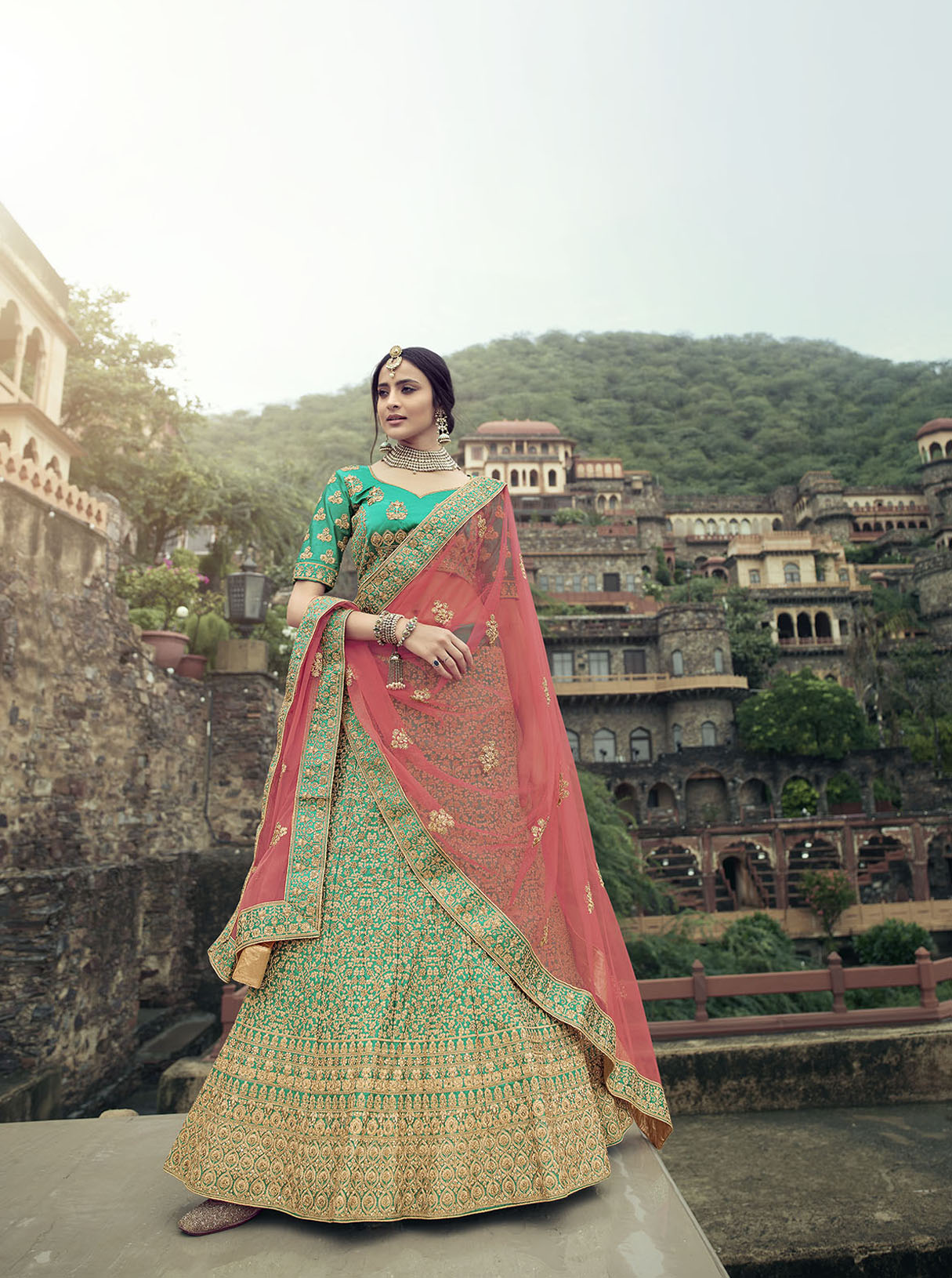 green-heavy-embroidered-satin-lehenga-choli